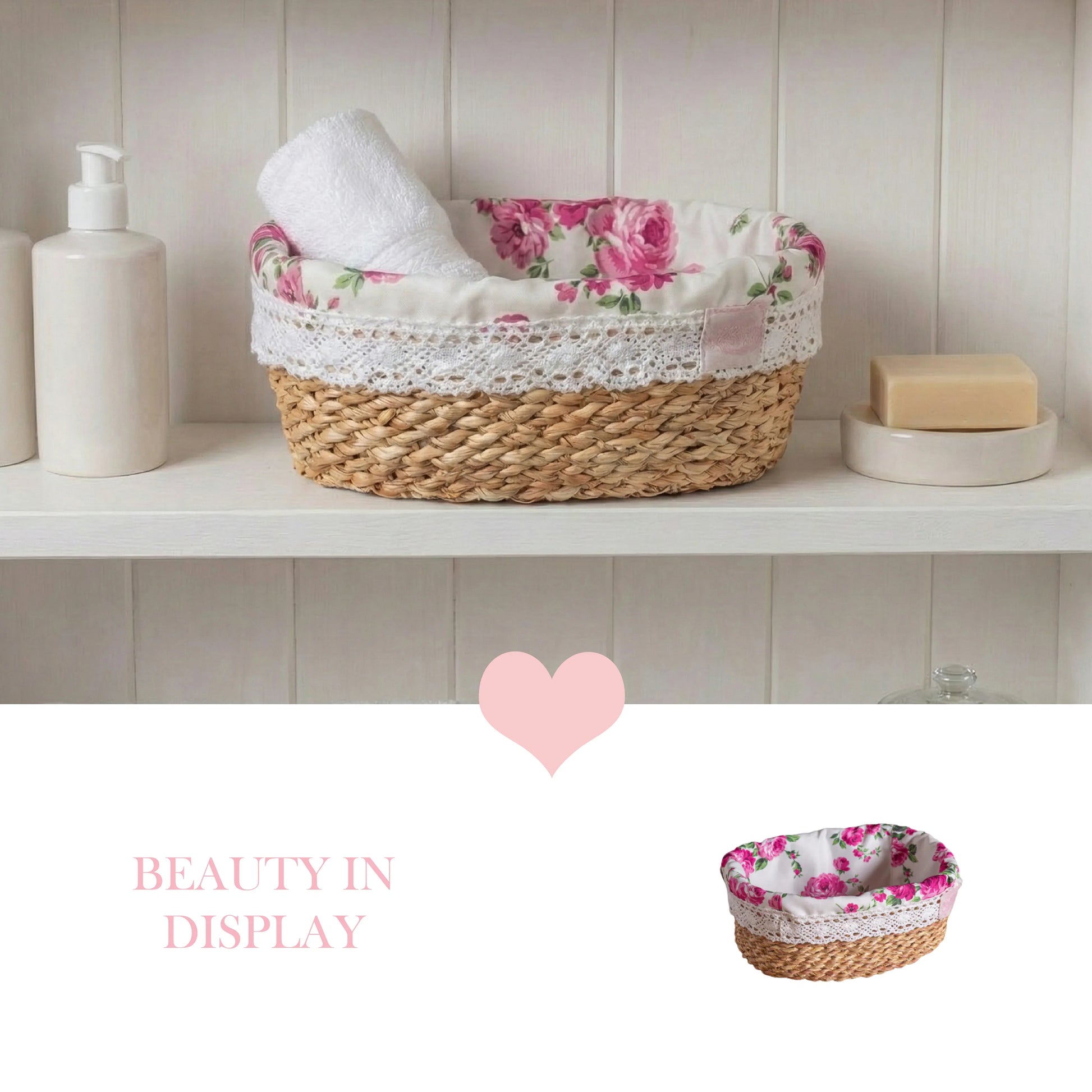 A fleur oval halfa woven basket with a pink rose fabric liner holding a white towel on a white bathroom shelf.