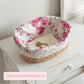 Fleur Halfa Oval Basket with floral liner holding envelope and keys on white table surface
