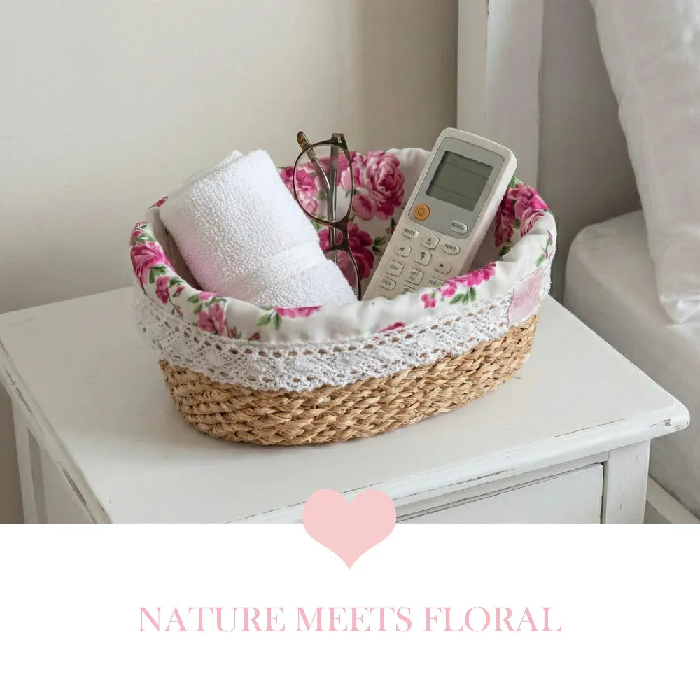 Fleur Halfa Oval Basket with towel, glasses and remote on white surface