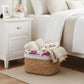 Fleur Halfa Square Basket woven storage basket beside bed in bedroom with decorative items for home decor organization