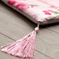 Fleur Haven Padded Prayer Rug floral patterned with tassel displayed on wooden surface