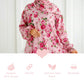 Pink floral Isdal Prayer dress with a white background