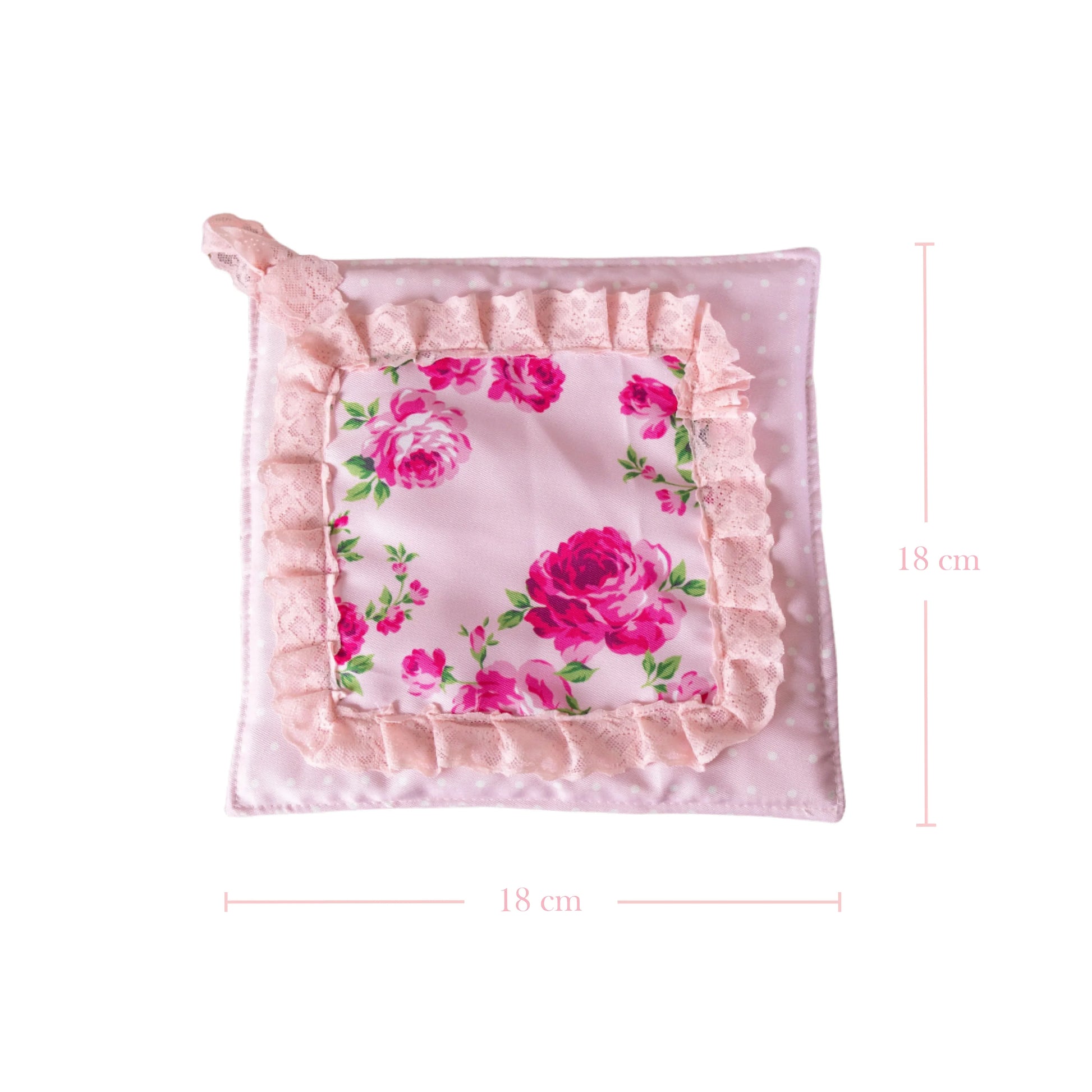 Square pink pot holder with a rose floral pattern, lace ruffles, and dimension lines showing 18 cm by 18 cm.
