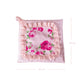 Floral patterned fabric square pot holder with pink ruffled edges and dimensions on a white background