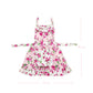 Pink floral apron with ruffles and a front pocket, showing dimensions of 90 cm in height and 70 cm in width.