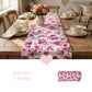 Floral table runner on a wooden dining table with cups and plates, heart graphic overlay.
