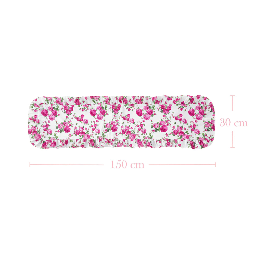 White ruffled table runner with a pink rose floral pattern and size dimensions 150 cm by 30 cm.