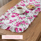 Floral table runner with tea and cookies on a wooden table, labeled 'Timeless Charm'.
