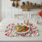 Fleur Placemat used in dining setup with fish served on plates over wooden table