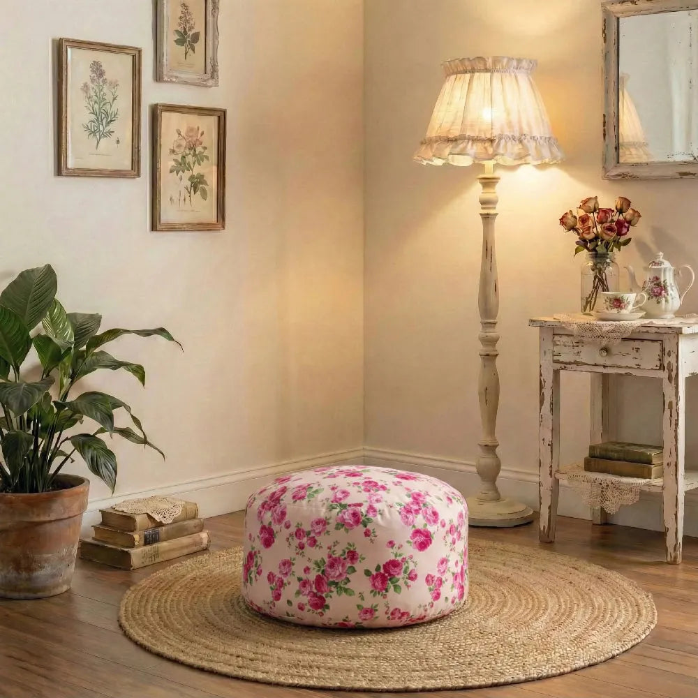 Floral ottoman in a cozy living room with a lamp, books, and a plant.