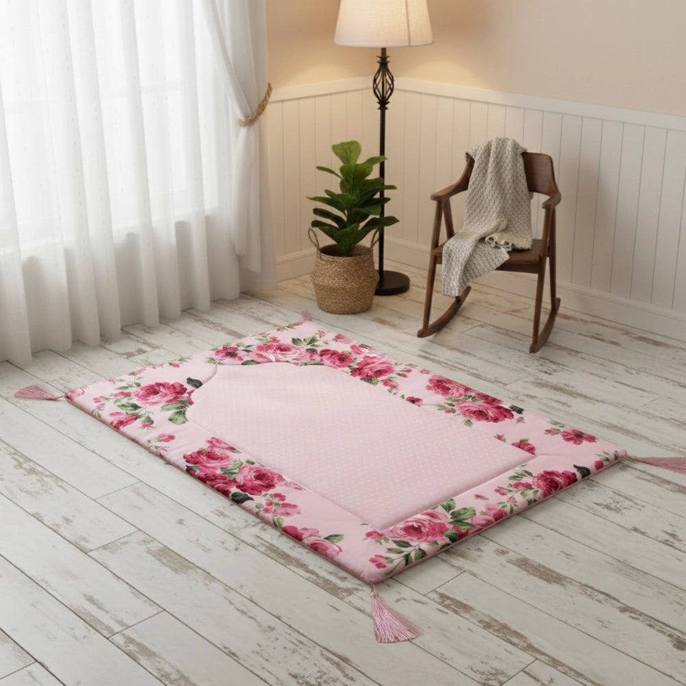 Floral rug on a wooden floor with a rocking chair and lamp in the background.