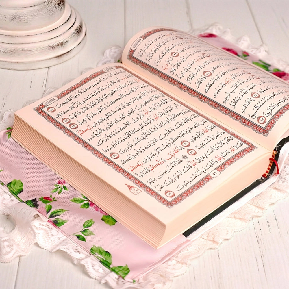Fleur Quran Cover open Quran book displayed on floral fabric background for Islamic home decor