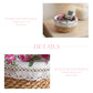 A product detail graphic for the round Fleur basket, featuring a lifestyle shot of the basket used as a nightstand organizer and a close-up highlighting the rose print liner and crochet lace trim.