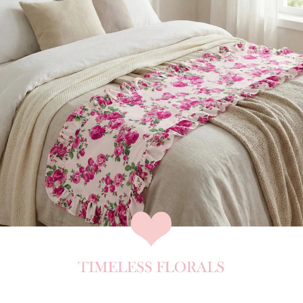 Fleur Table Runner placed on bed with floral pattern and Timeless Florals text overlay
