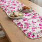 Fleur Table Runner styled on wooden dining table with plated food setup for dining decor