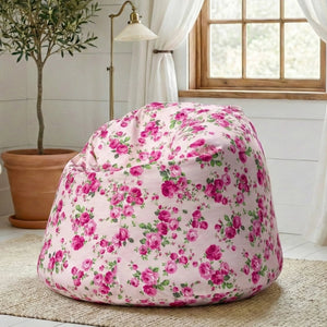 Floral bean bag chair in a room with a plant and window.