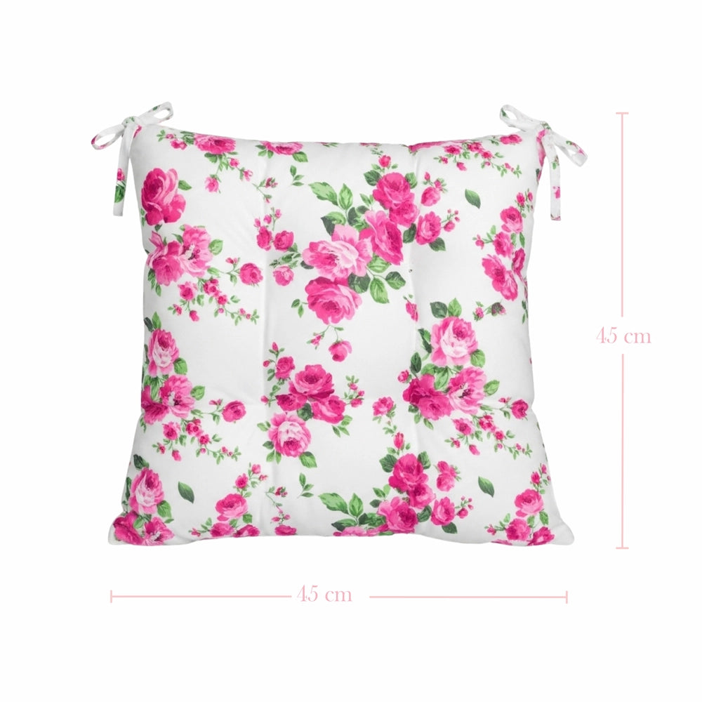 Floral-patterned cushion with pink roses on a white background, featuring dimensions.