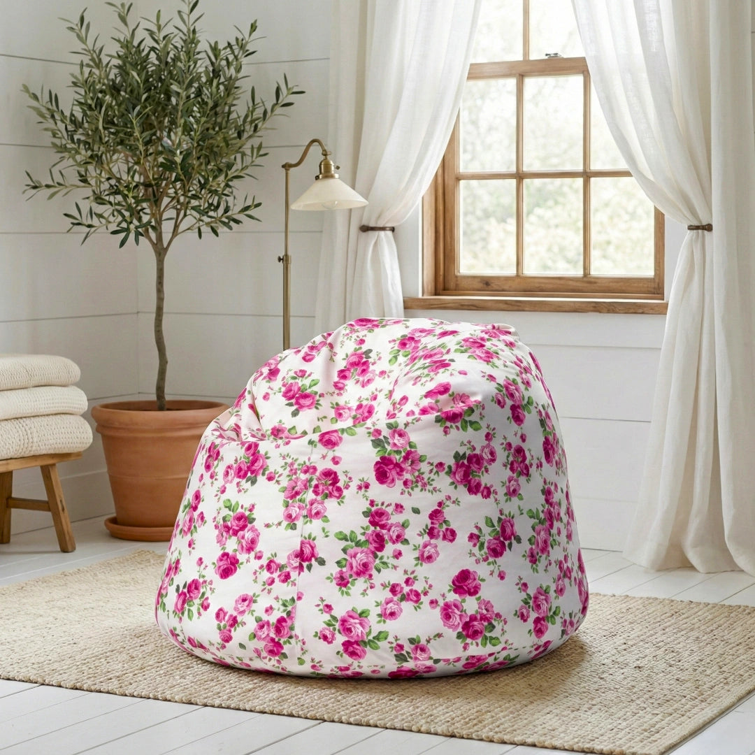 Floral-patterned bean bag chair in a room with a plant and window.