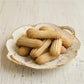 Nashader Biscuits on a decorative plate with floral patterns on a light wooden surface