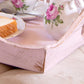 Tea set with floral design on a wooden tray