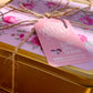 Gold box with floral packaging and pink tag featuring 'Country Charm' branding.