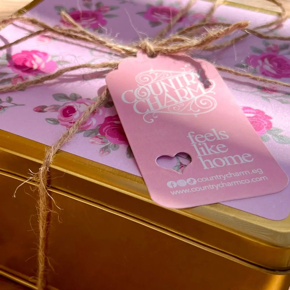 Gold box with floral packaging and pink tag featuring 'Country Charm' branding.