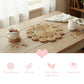 Halfa Flower-Shaped Placemat styled on wooden table with tea and pitcher highlighting woven texture and floral design