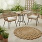 Outdoor patio set with two chairs, a table, and a round jute rug on a tiled floor.