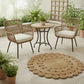 Outdoor patio set with two chairs, a table, and a round jute rug on a tiled floor.