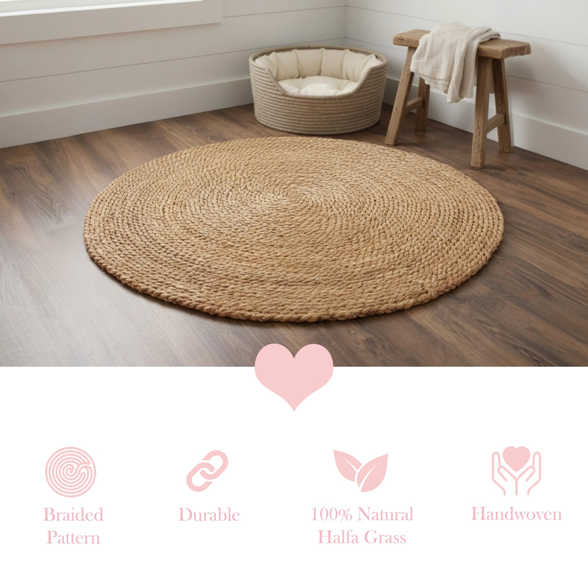 Round braided jute rug on a wooden floor with a small wooden stool and pet bed in the background.