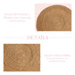 Half a round rug made of grass fiber with text describing its features on a pink background.