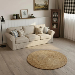 Halfa Round Rug in living room with beige sofa, wooden floor, natural woven texture home decor