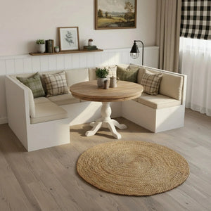 Modern living room with a white sectional sofa, wooden table, and decorative elements.