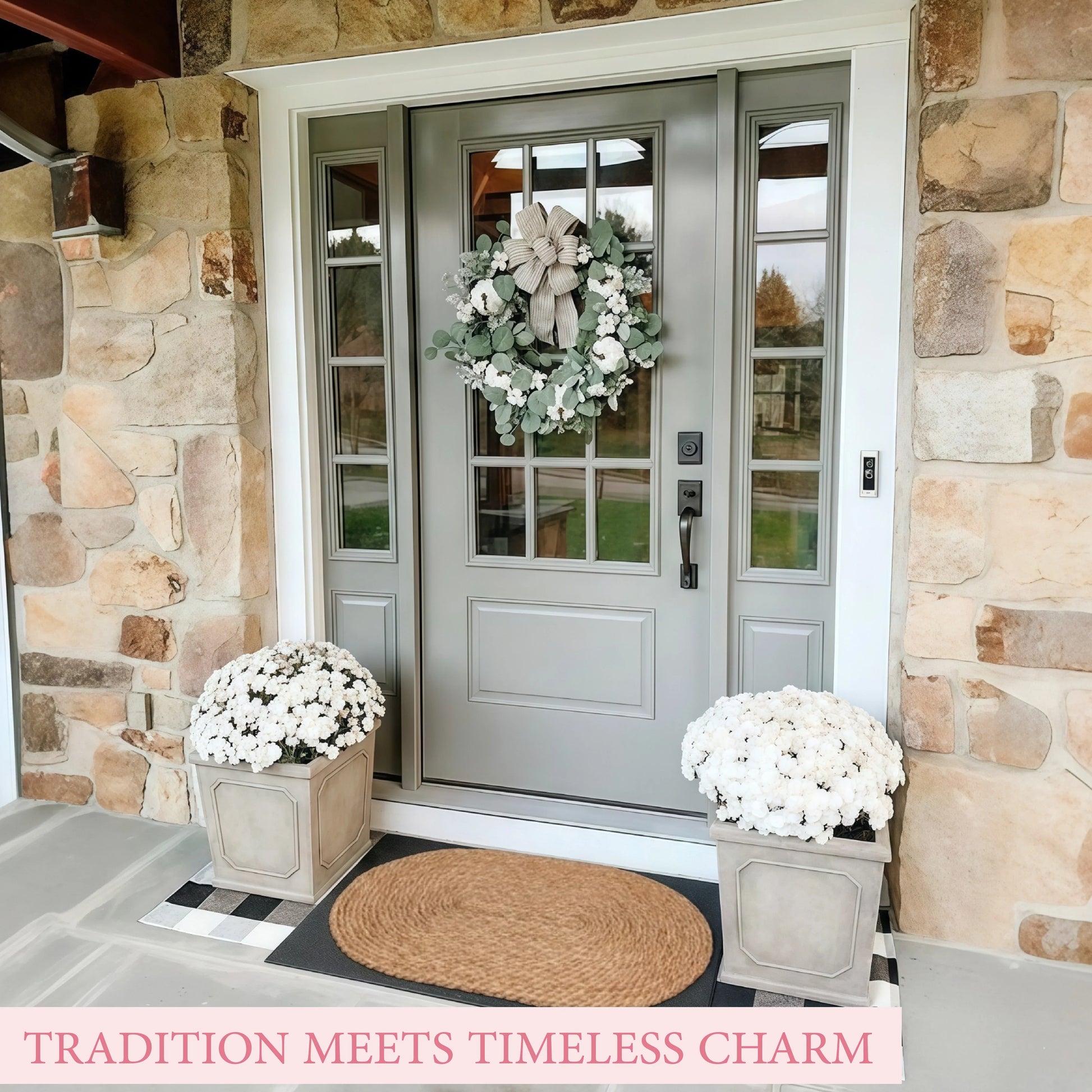 Front door of a house with a wreath and potted plants, stone wall background