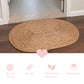 Round braided mat on a wooden floor with product features displayed below.