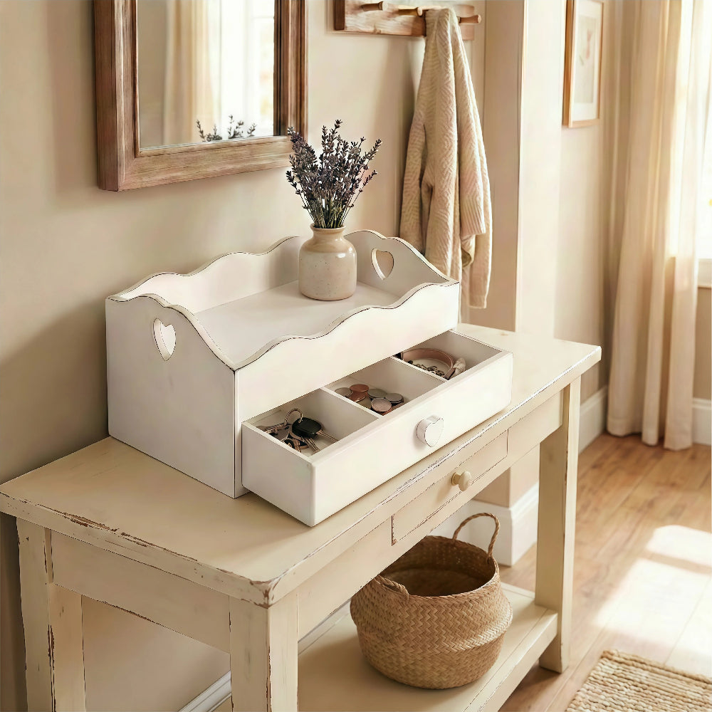 White wooden Heart Cut-Out Flatware Tray styled as a hallway or entryway organizer on a console table, storing keys, coins, and jewelry under a decorative mirror.