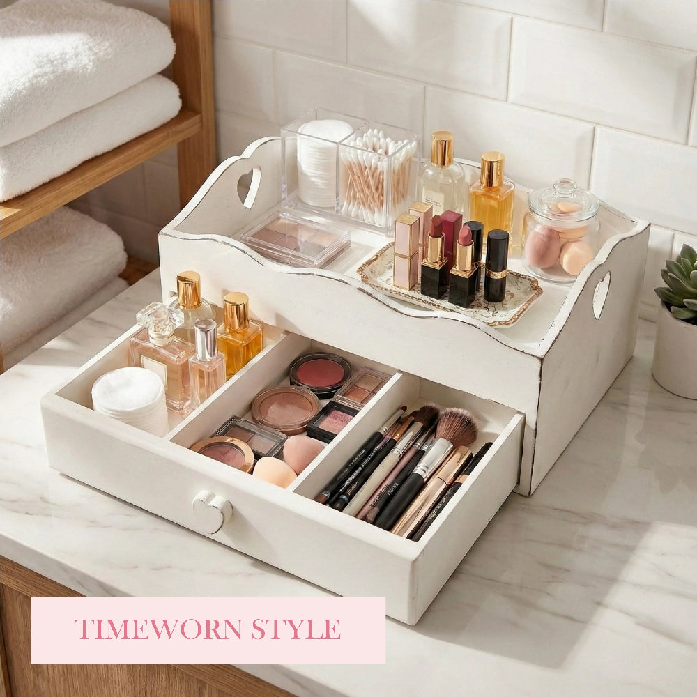 White wooden Heart Cut-Out Flatware Tray styled as a vanity organizer with cosmetics, perfumes, and makeup brushes on a marble surface with "Timeless Style" text.