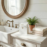 Heart Cut-Out Tissue Holder on bathroom vanity with sink, mirror and towels