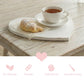 Heart-Shaped Serving Board used for tea and croissant on wooden table with eco-friendly solid wood icons