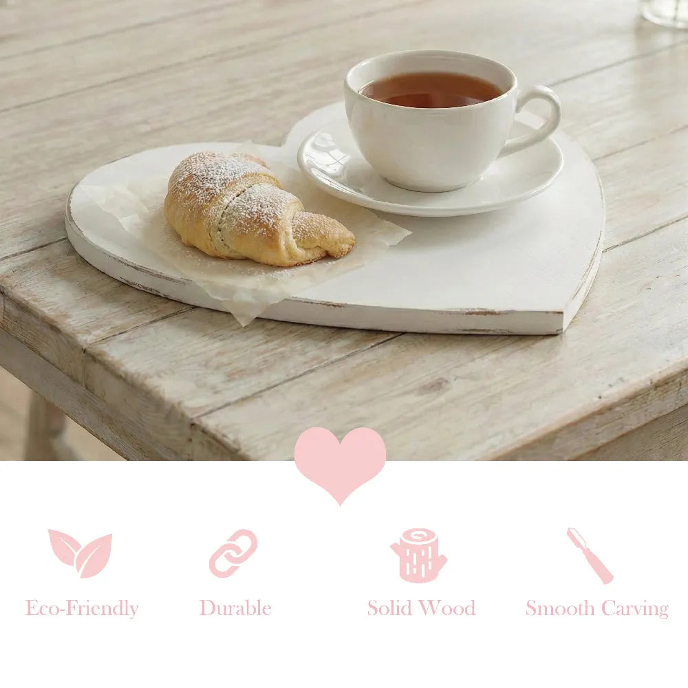 Heart-Shaped Serving Board used for tea and croissant on wooden table with eco-friendly solid wood icons