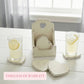 Two glasses of lemonade on heart coasters next to a tall white wooden holder on a white table with text.
