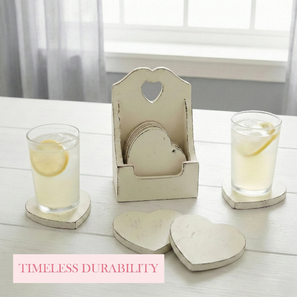 Two glasses of lemonade on heart coasters next to a tall white wooden holder on a white table with text.