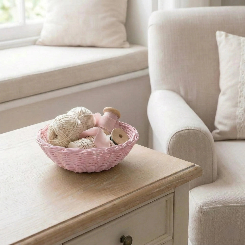 Mini Wicker Basket pink woven storage basket holding yarn and knitting needles on wooden table home decor