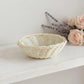 Mini Wicker Basket placed on white surface with flowers in background for home decor styling