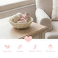 Mini Wicker Basket woven storage basket with yarn and wooden toys on wooden table beside beige armchair
