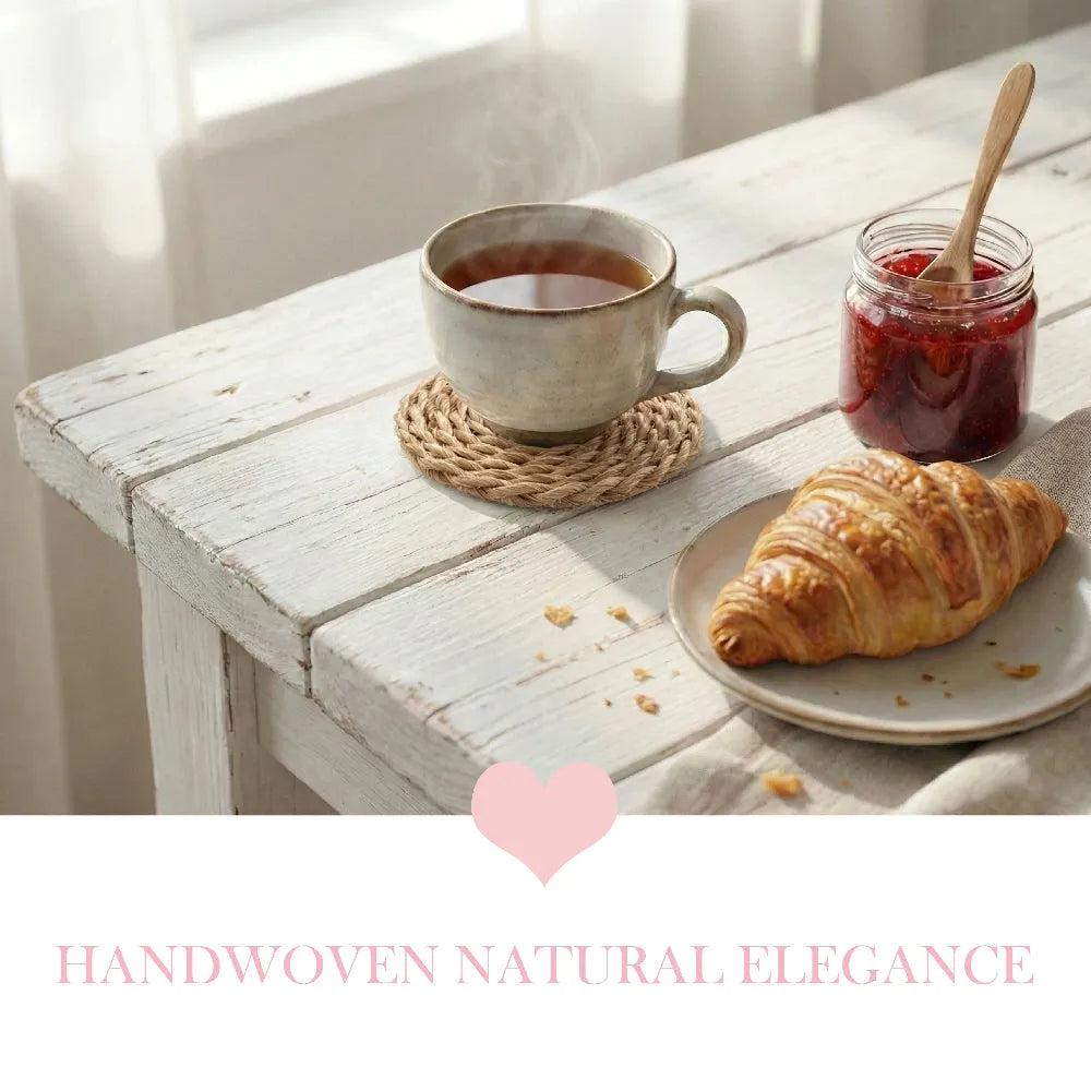 Cup of tea with a croissant and jar of jam on a wooden table, with 'Handwoven Natural Elegance' text.