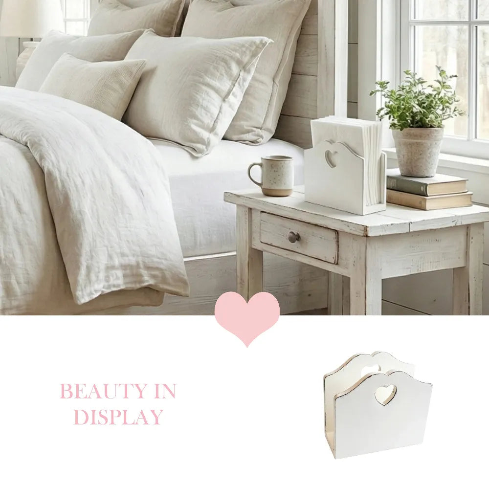 Neatly made bed with pillows and a small table with decor items in a bright room.