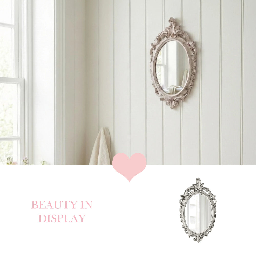 Ornate oval vintage mirror hanging on white shiplap wall next to a window, above a pink heart and graphic text.