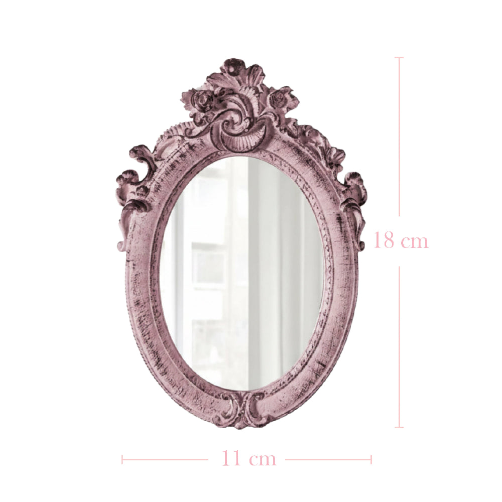 Ornate pink oval mirror with dimension lines showing 18 cm height and 11 cm width on a white background.
