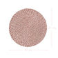 Round pink woven mat with dimensions on a white background